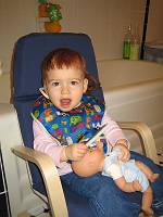  First haircut, dad plays stylist.