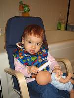 First haircut, dad plays stylist.