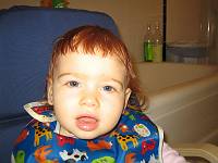  First haircut, dad plays stylist.