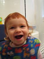  First haircut, dad plays stylist.